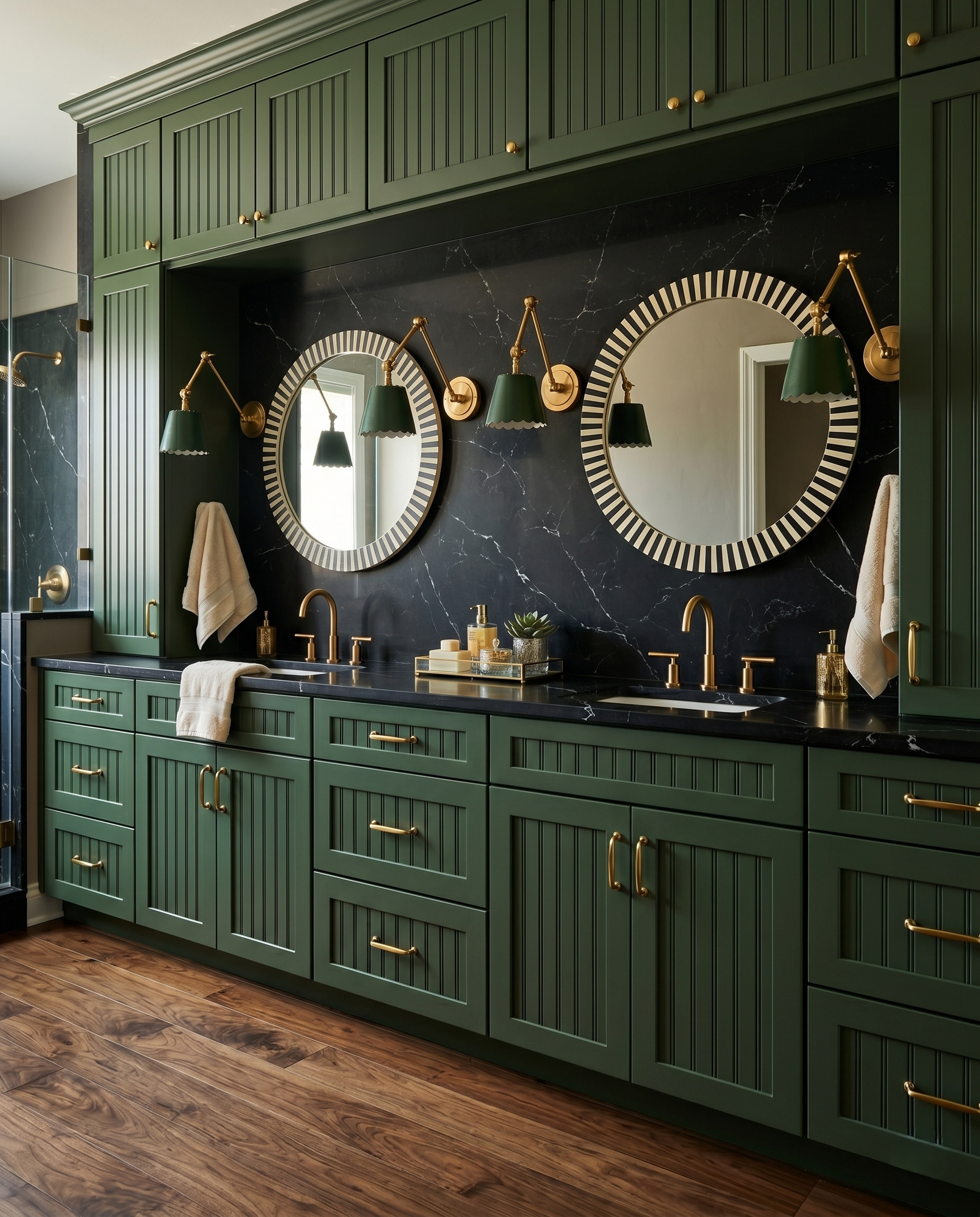 Round mirrors with black-and-cream striped frames above an olive double vanity, dark veined walls and green shaded sconces.
