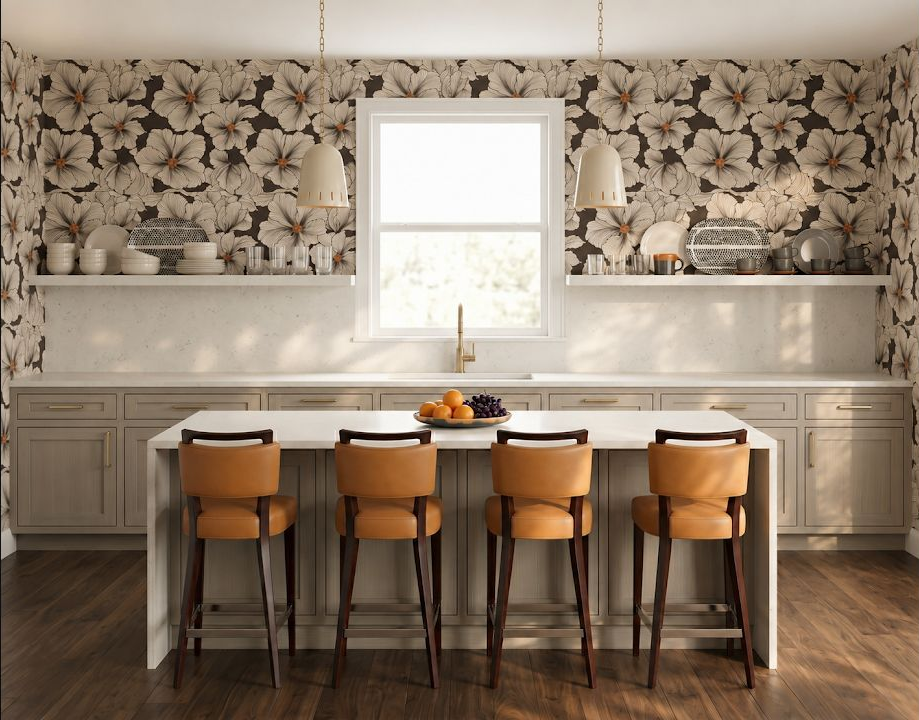 Concept image of a beige kitchen with four wood stools lined along a large island beneath a floral wall.