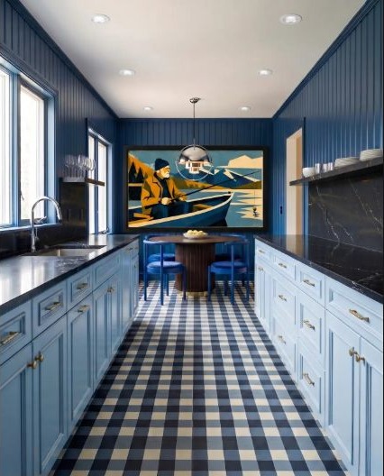 Saturated blue kitchen cabinetry used as one confident color statement.