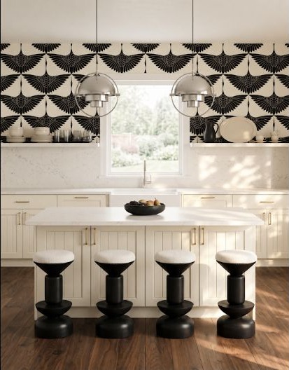 A high-contrast black-and-white kitchen using graphic pattern in a restrained palette.