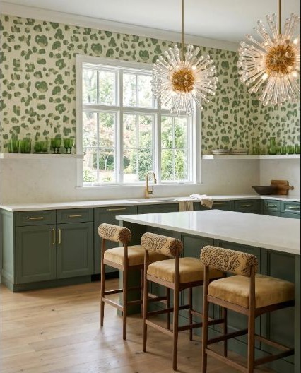 Deep green kitchen cabinetry grounding a playful leopard-inspired pattern.