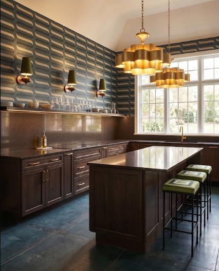 A kitchen pairing brown counters with a lively patterned feature wall.