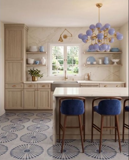 Blue kitchen cabinetry softened by warm beige surfaces.