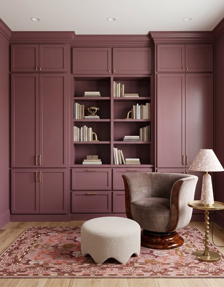 Plum built-in wall combining open shelves, drawers, tall closed cabinets, and a seating area.