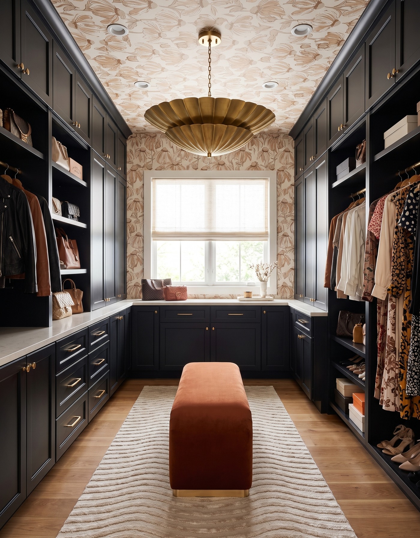 AI-created concept: Ink-black closet with cream-and-camel botanical ceiling wallpaper, a rust bench, pale rug and brass-toned pendant.