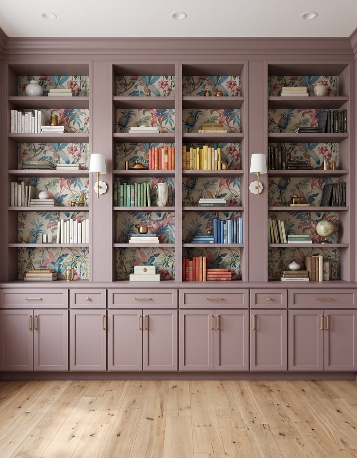 Muted purple library cabinets with open shelves, lower doors, and botanical shelf backs.