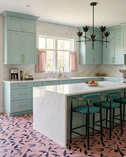 A pale veined slab extending to the ceiling around a window and turquoise cabinetry.