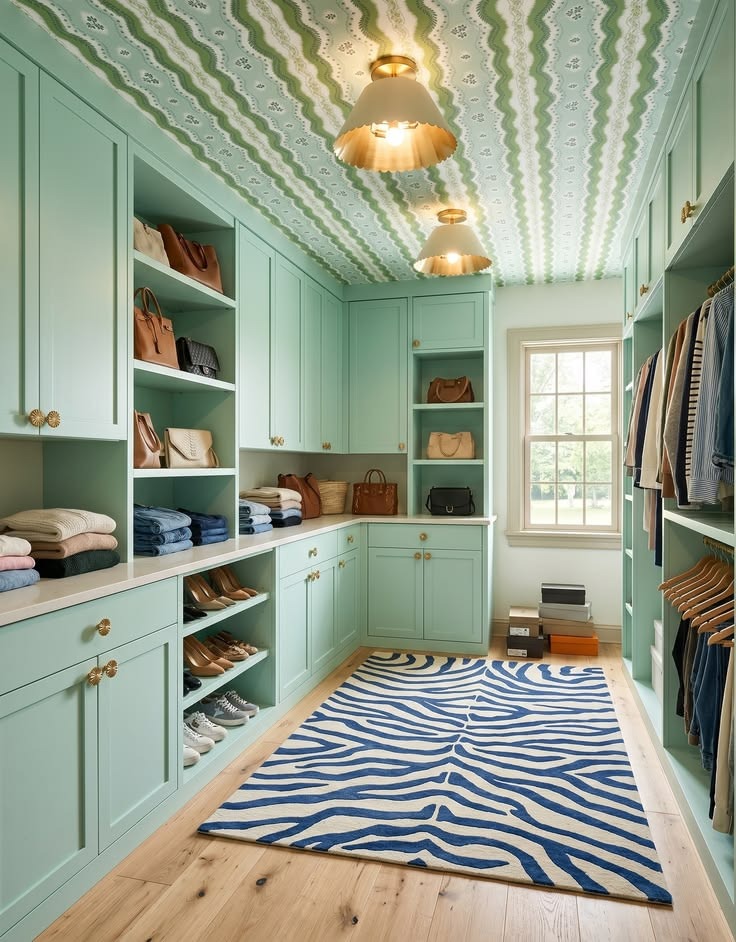 Mint storage room with open floor space, low drawers, tall cabinets, and a blue patterned rug.